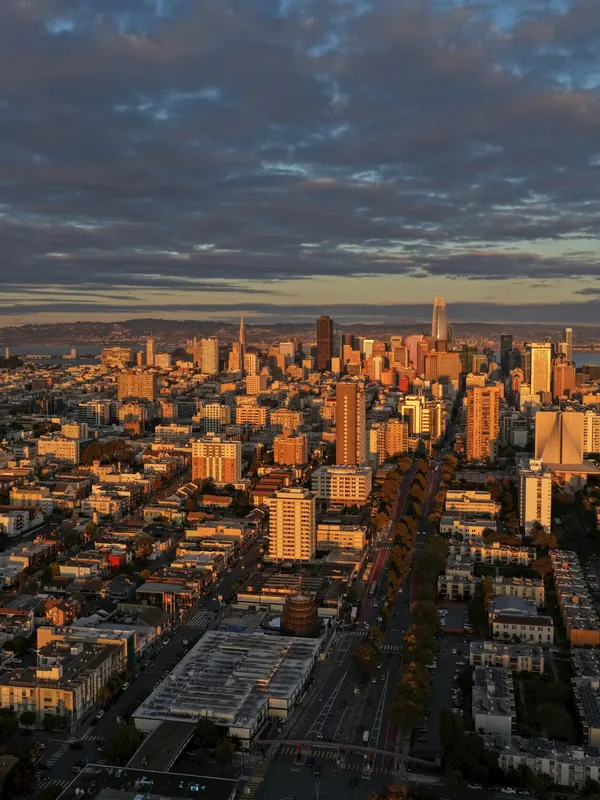 A city and its buildings in warm evening light